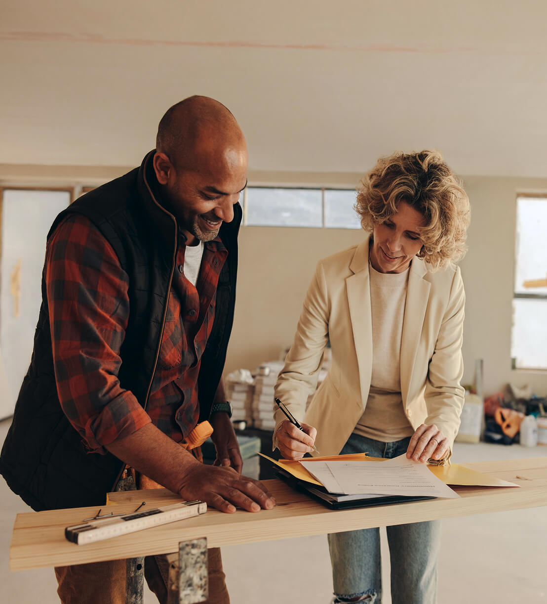 Contractor reviewing plans with a homeowner