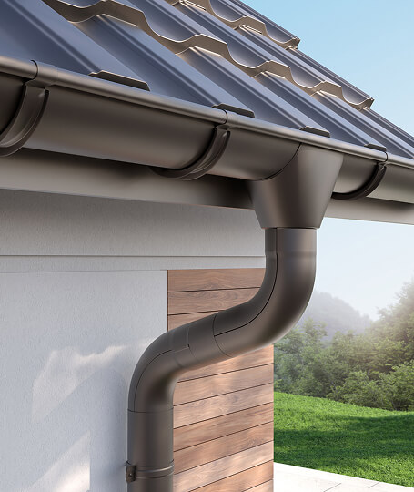 Bronze round downspout modern home