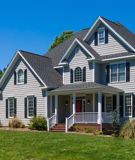 Gray craftsman dark shutters and red front door