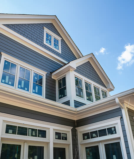 Dark blue craftsman white trim double hung windows